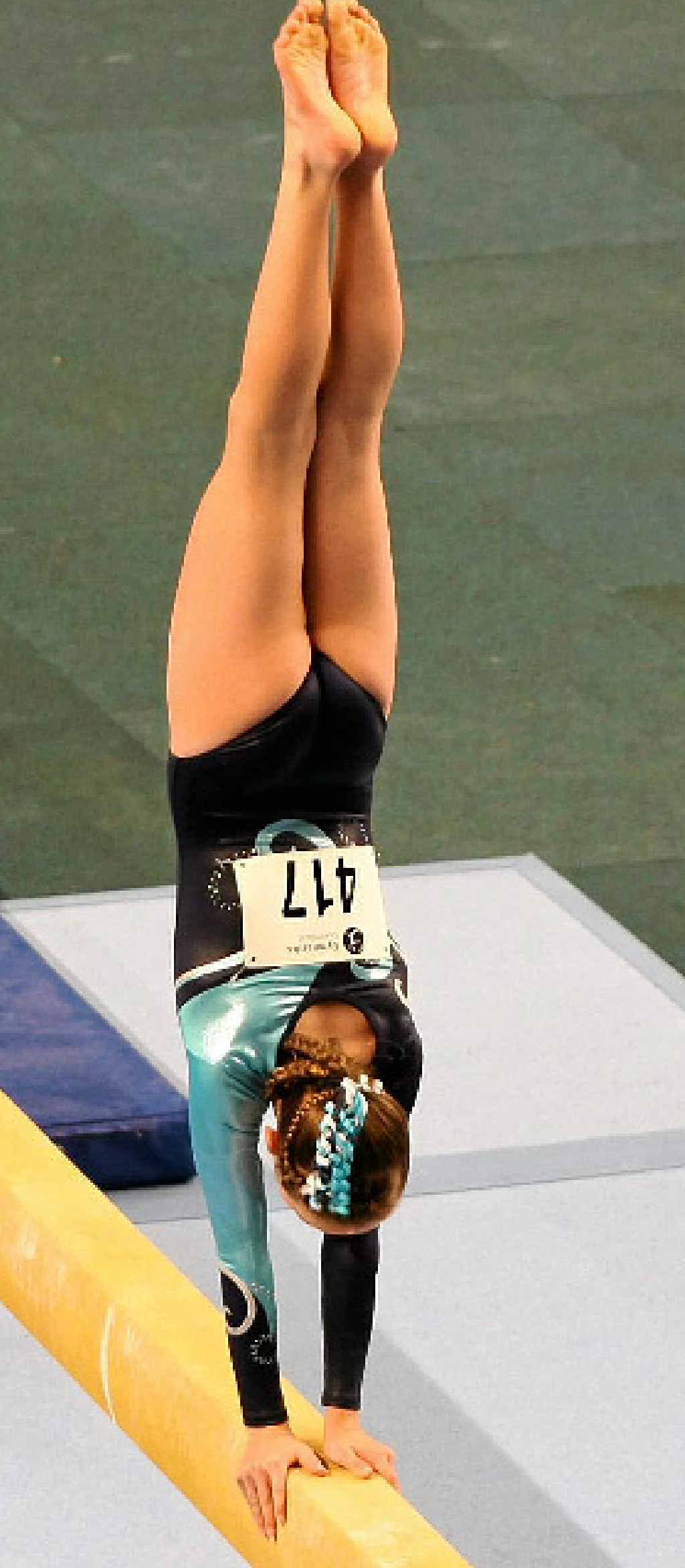 ON THE BEAM: Nikki Burraston shows her style on beam at the state championships.